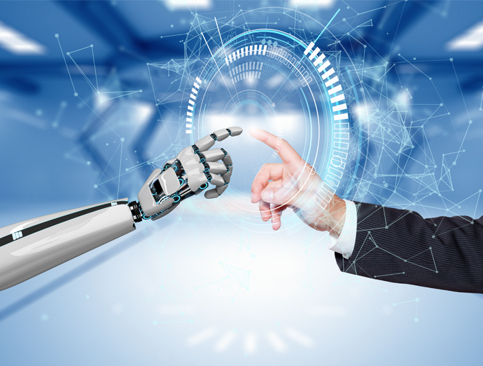 A robot hand and a human hand touch each other at the fingertips ©Alexander Limbach - stock.adobe.com