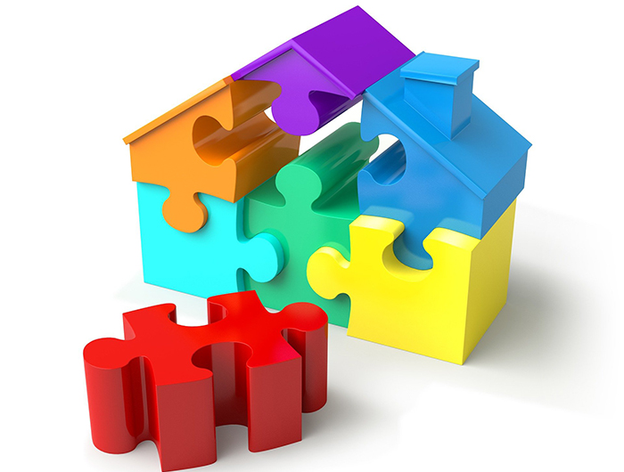 Colourful puzzle pieces form a house ©AbsolutVision - Pixabay.com