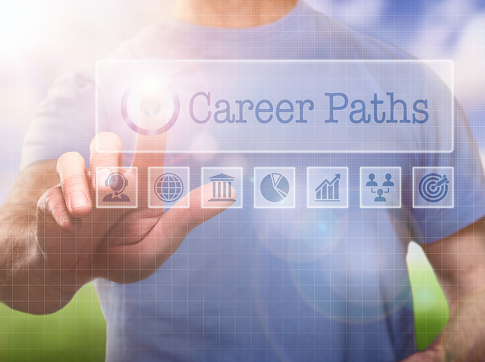 A man in a t-shirt outside selecting a career path ©By Duncan Andison; stock.adobe.com