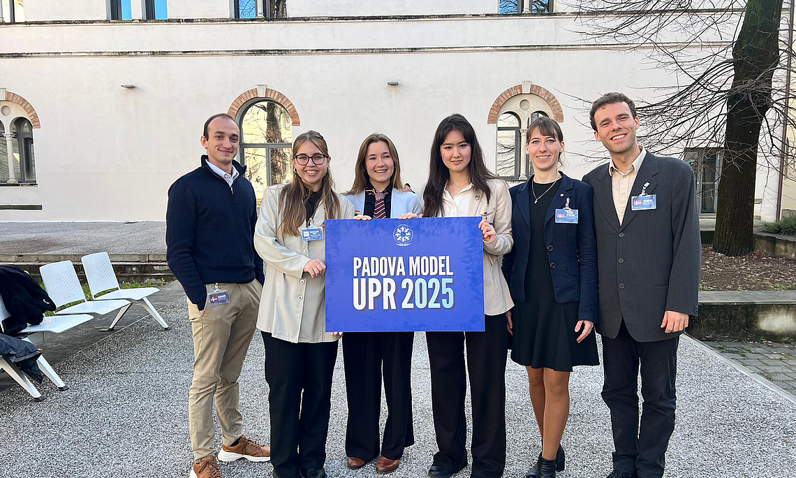 participants with banner of event