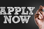 Apply now written in white letters on black background