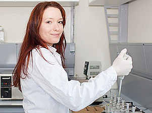 Young woman in a lab coat with pipette ©BioTechMed-Graz