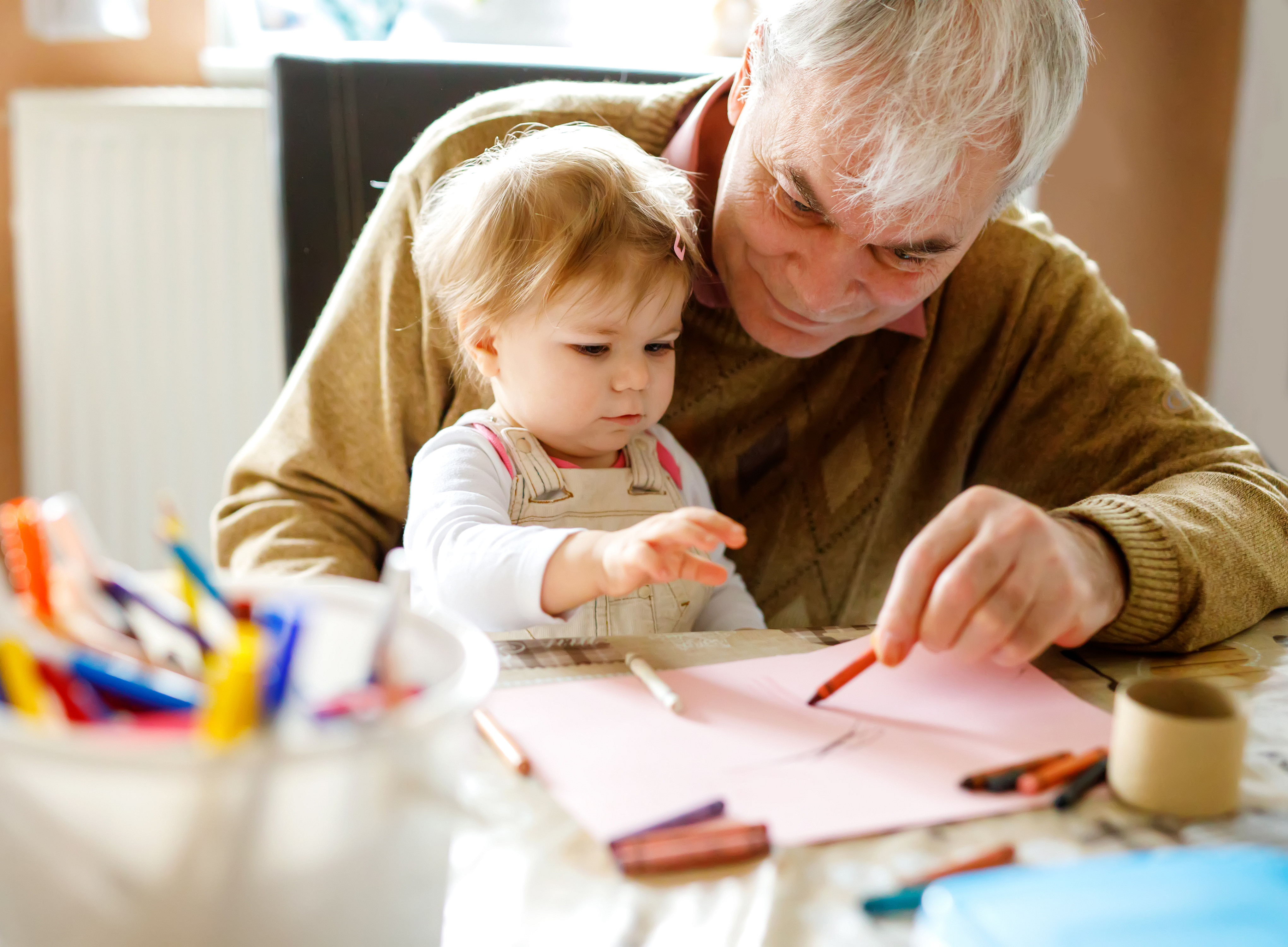 elderly person cares about a young kid ©Irina Schmidt - stock.adobe.com
