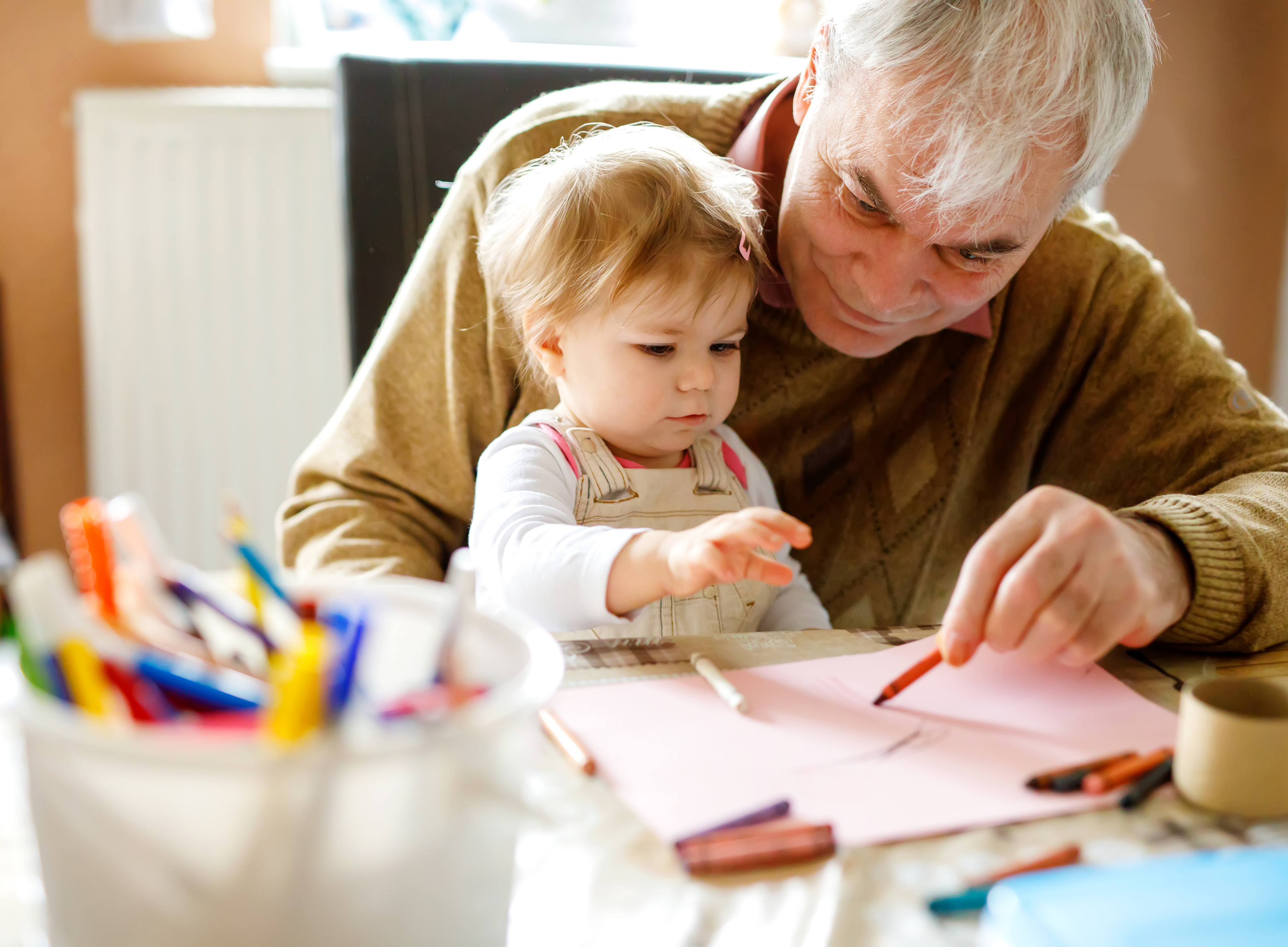 old person taking care of child symbolizing care ©Irina Schmidt - stock.adobe.com