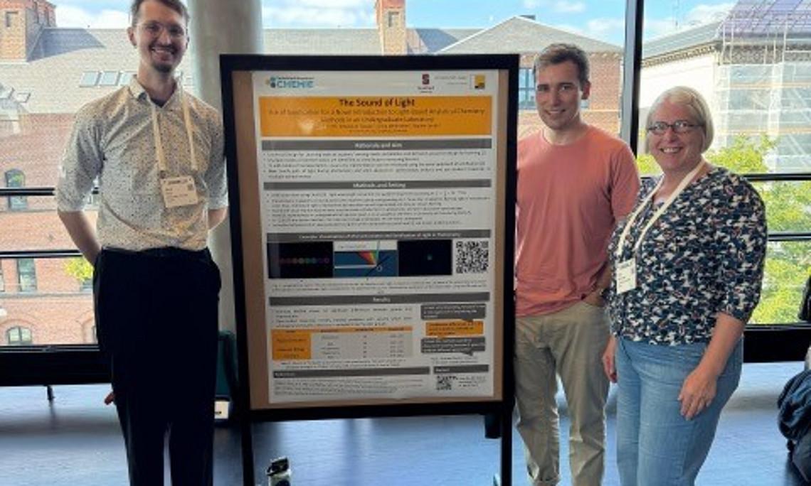 Silvia, Sebastian and David in front of the posters at conference