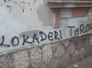 The image shows graffiti spray-painted on a wall. The text reads "BLOKADERI TERORISTI" in black paint. ©@ Claudia Mayr Veselinovic 10.11.2025 in Belgrad