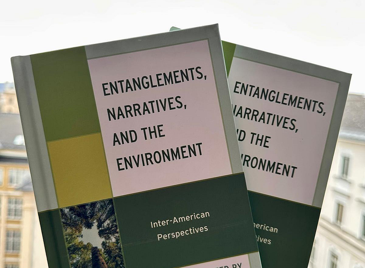 Green books with hand outstretched 