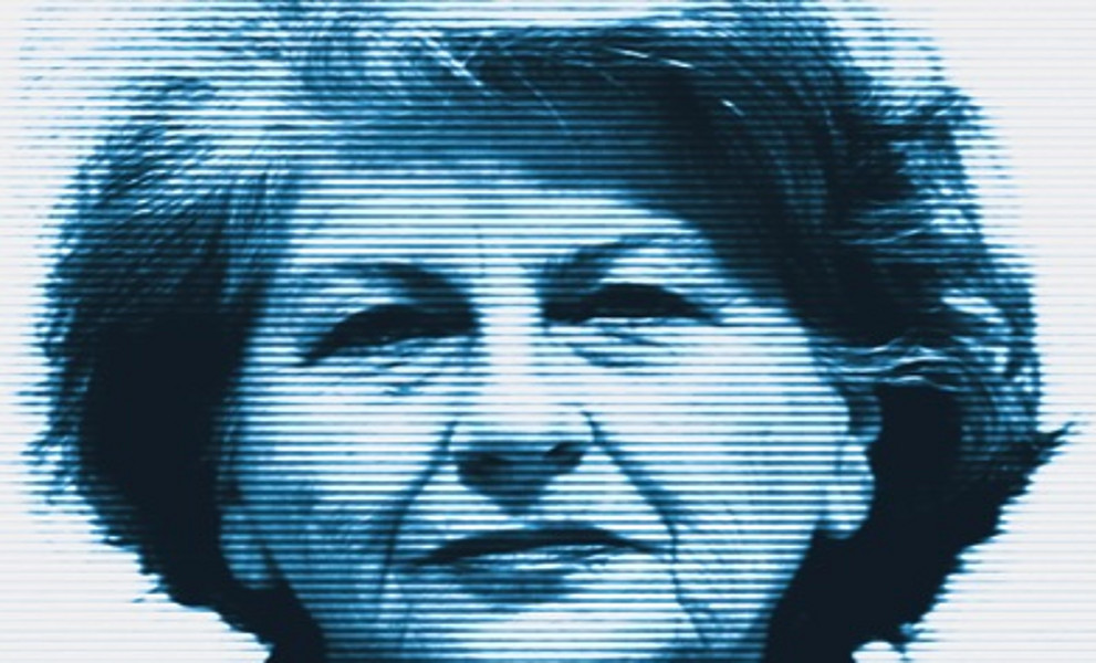 The cover of Madam War Criminal features a stark, blue-toned portrait of an older woman staring directly at the viewer, giving the image a serious, confrontational feel. 