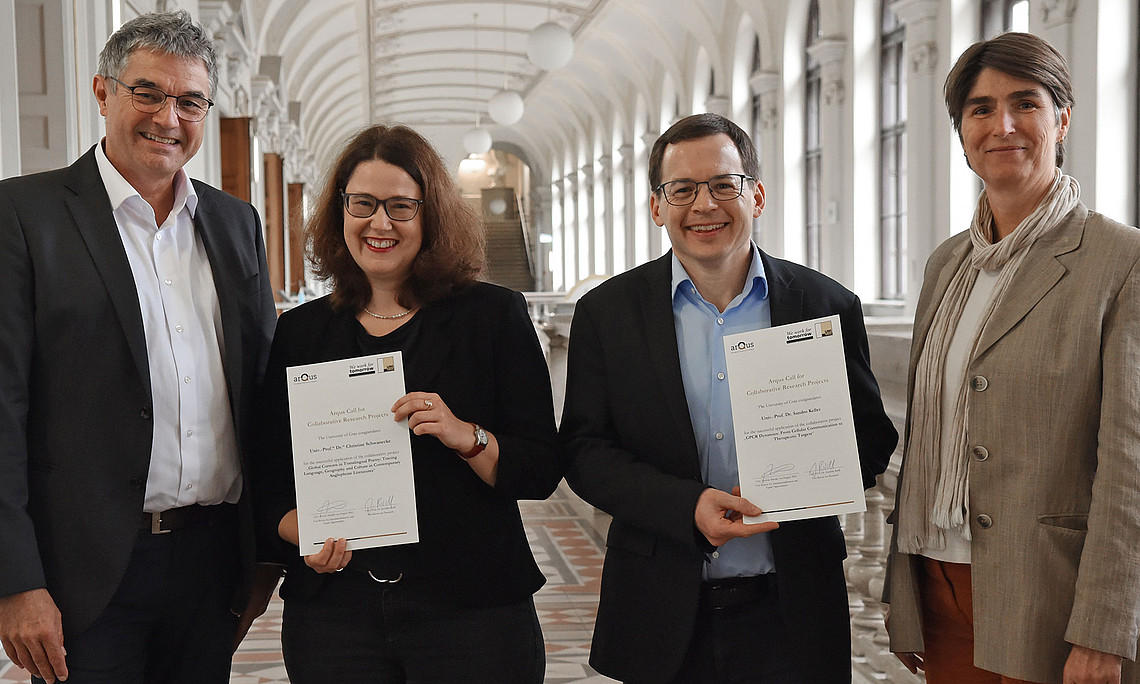 Joachim Reidl, Christine Schwanecke, Sandro Keller and Mireille van Poppel in the corridor in front of the auditorium of the University of Graz