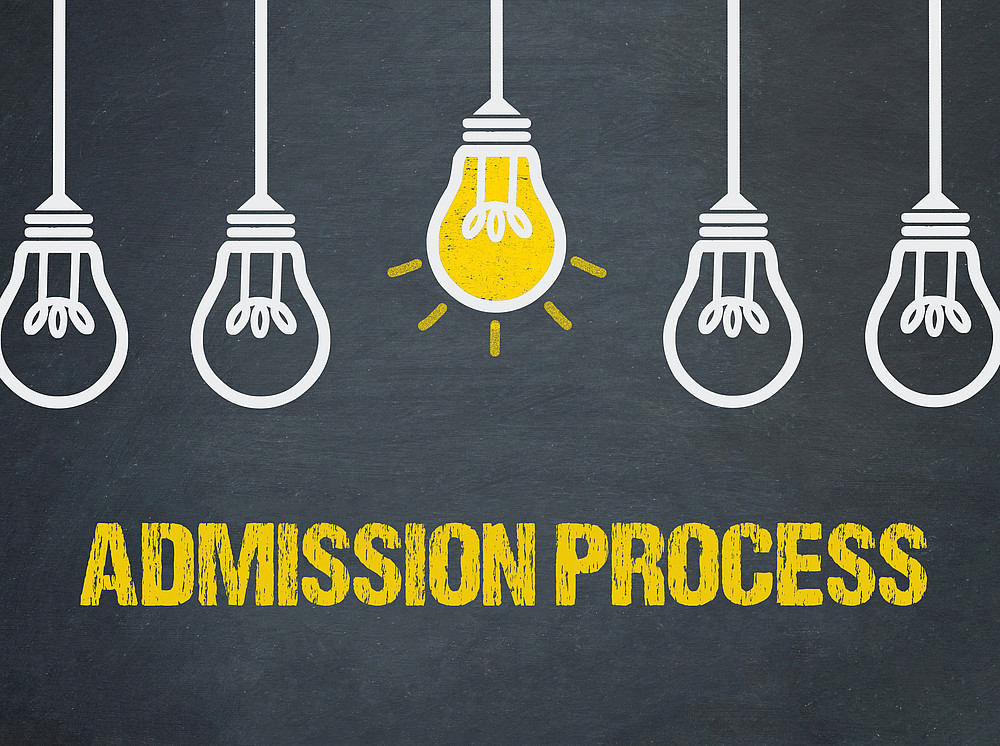 admission process written on a black background with light bulbs ©By Coloures-Pic; stock.adobe.com 