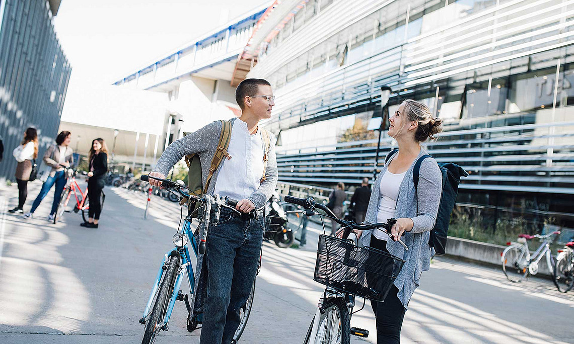 two students with a bike