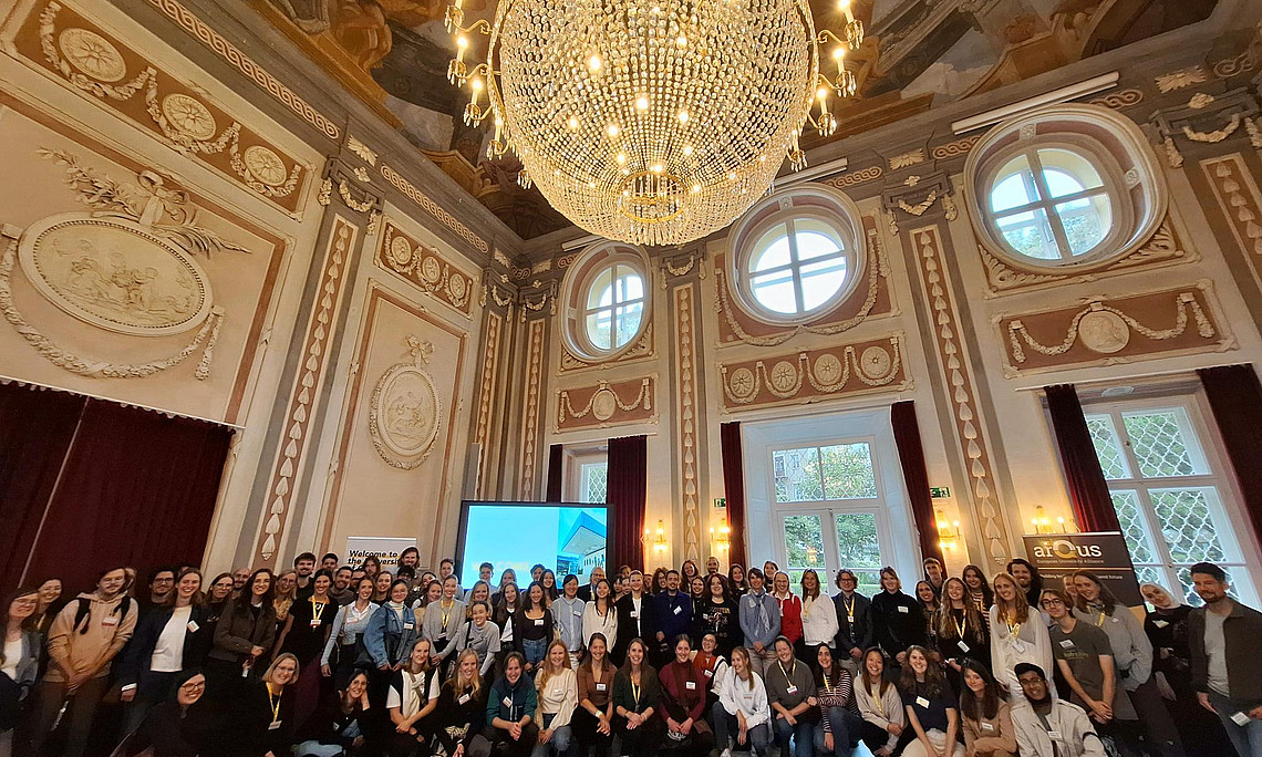 picture of students, academics and administrative staff in a ballroom at the university of graz attending the welcome and networking event for joint master programmes