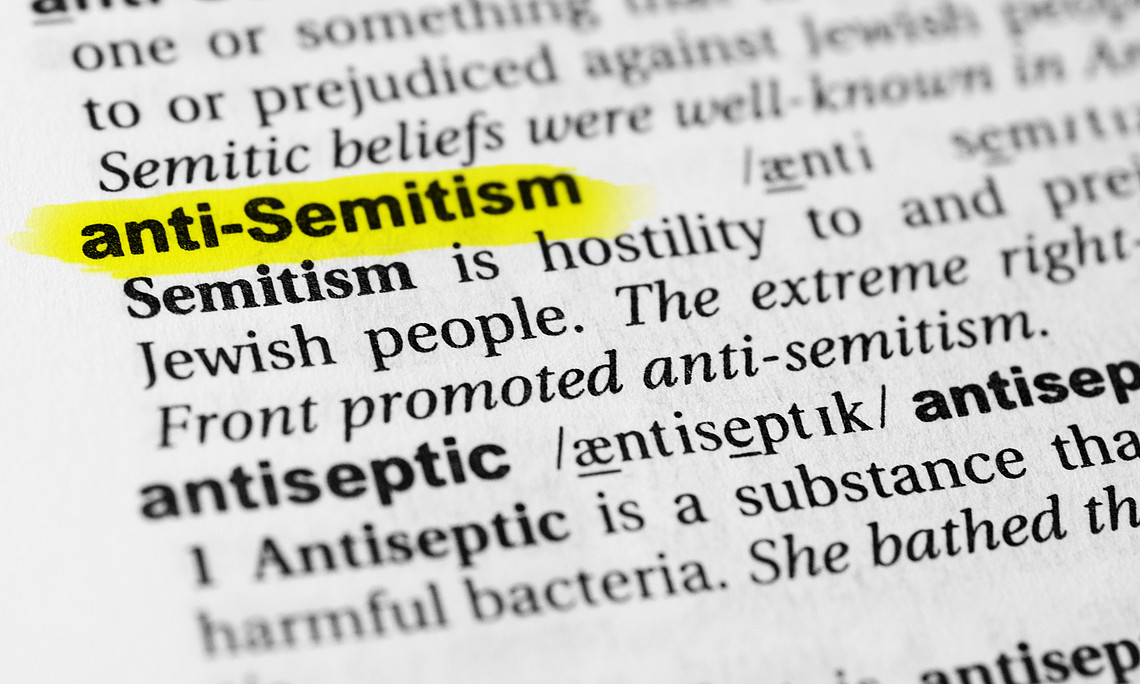 highlighted English word "antisemitism" and its definition in a dictionary