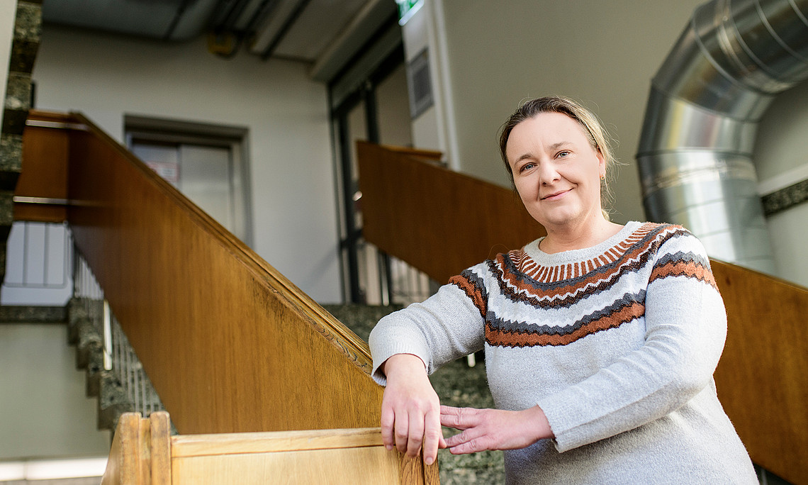 Katalin Barta Weissert on the stairway of the Department of Chemistry