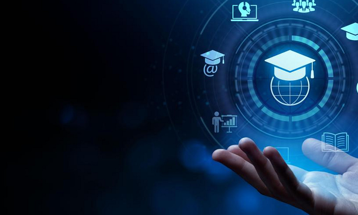 The image shows an open human hand in the lower right corner, gently cupped as if supporting or presenting something. Above the hand, in the center, there is a glowing digital interface with a circular design. Inside the circle is an icon of a graduation cap resting on a globe, symbolizing global education and knowledge.