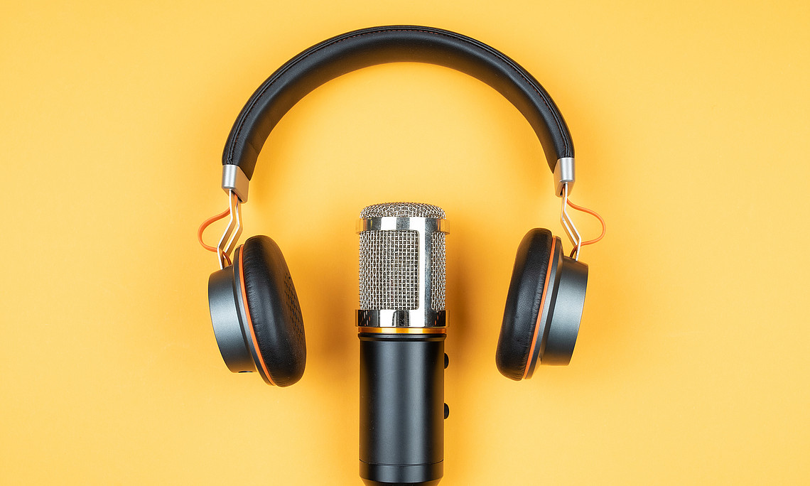 podcast, recording, concept, equipment, podcasting, headphones, microphone, symbol, media, entertainment, communication, nobody, no people, audio, technology, desk, earphones, broadcasting, broadcast, journalism, production, listen, colored background, orange, modern