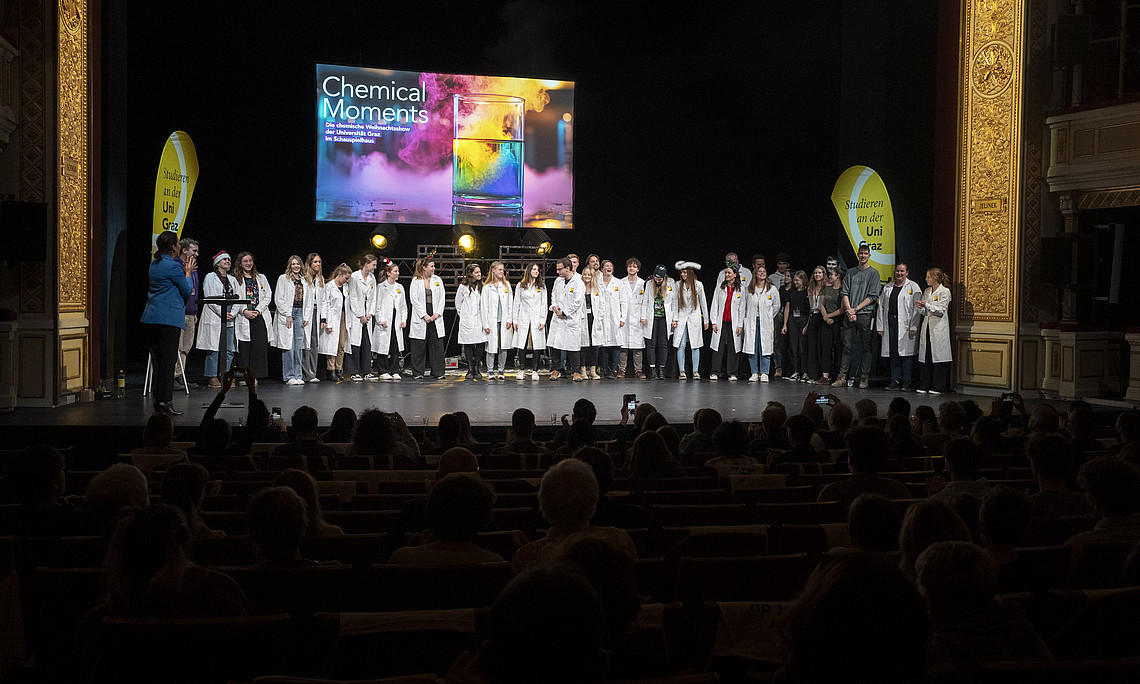 A large group of people on the stage of the Schauspielhaus Graz