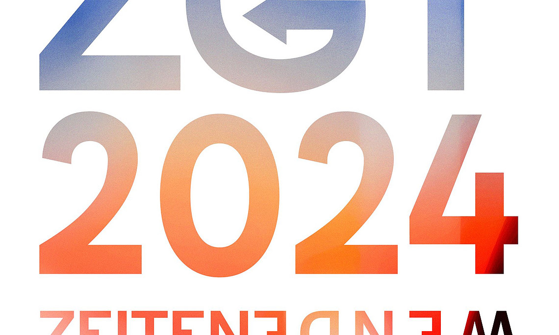 Das Bild zeigt das Logo des "ZGT 2024" am oberen Bildrand mit einem zusätzlichen Text darunter, der spiegelverkehrt dargestellt ist. Der Text lautet "ZEITENWENDE", was auf Deutsch "Wendezeit" oder "Zeitenwende" bedeutet. Die Wahl der spiegelverkehrten Darstellung könnte darauf hinweisen, dass es um eine Reflexion oder bedeutende Veränderungen geht, sowohl im wörtlichen als auch im übertragenen Sinne.