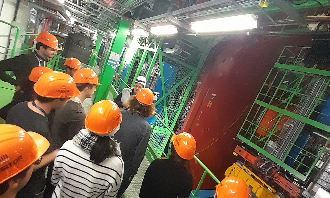 Manfred Jeitler (OeAW, in the background with white helmet) shows the guests from Graz the CMS detector, one of the flagship experiments at the Large Hadron Collider (LHC). Photo: University of Graz / Plätzer