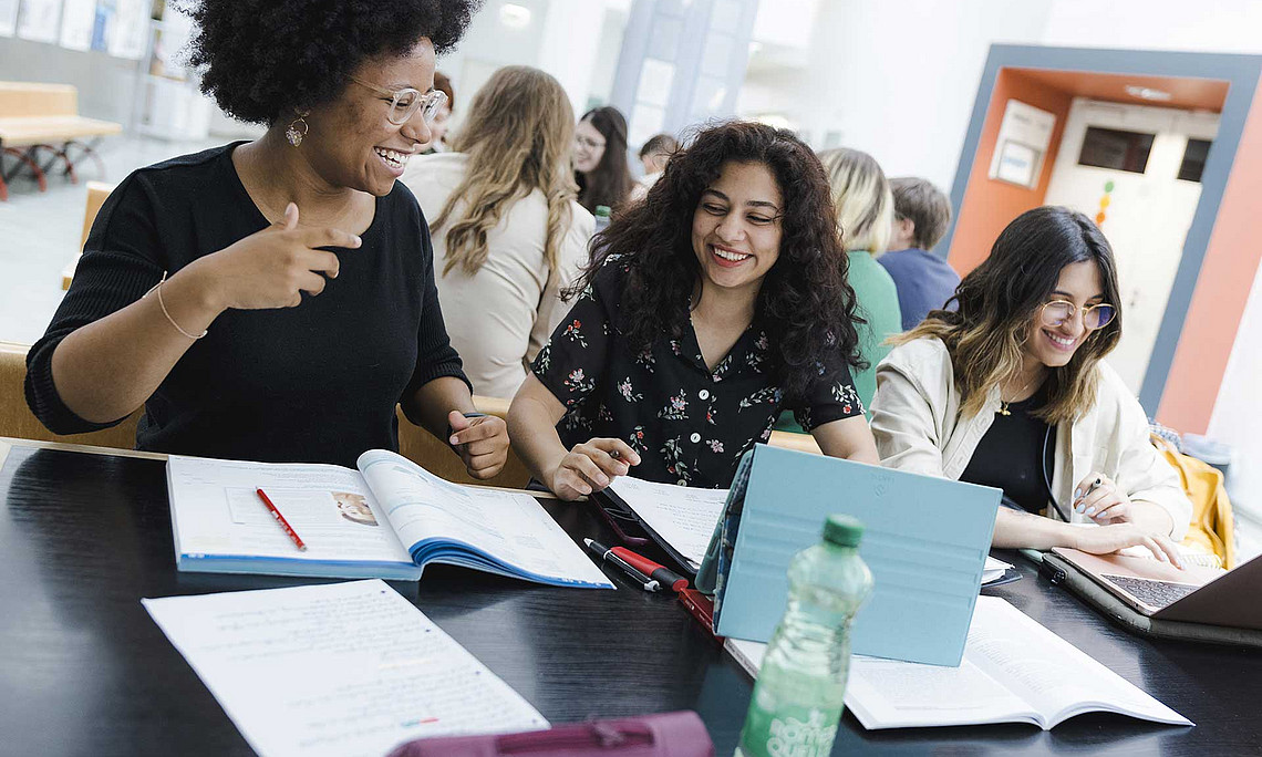 three students at the desk 