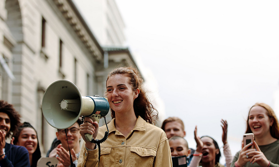 Woman with group of people in a rally