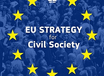 he picture features a large crowd of people, with a blue overlay. Superimposed on the image is a circle of yellow stars, representing the European Union (EU) flag. ©European Commission, Directorate-General for Enlargement and Eastern Neighbourhood Policy (DG ENEST), “European Democracy Shield