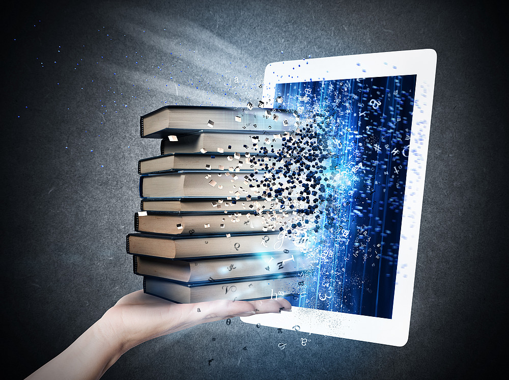 An iPad with several books transferred to its screen ©alphaspirit / AdobeStock