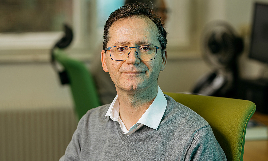 Man sitting on a desk 