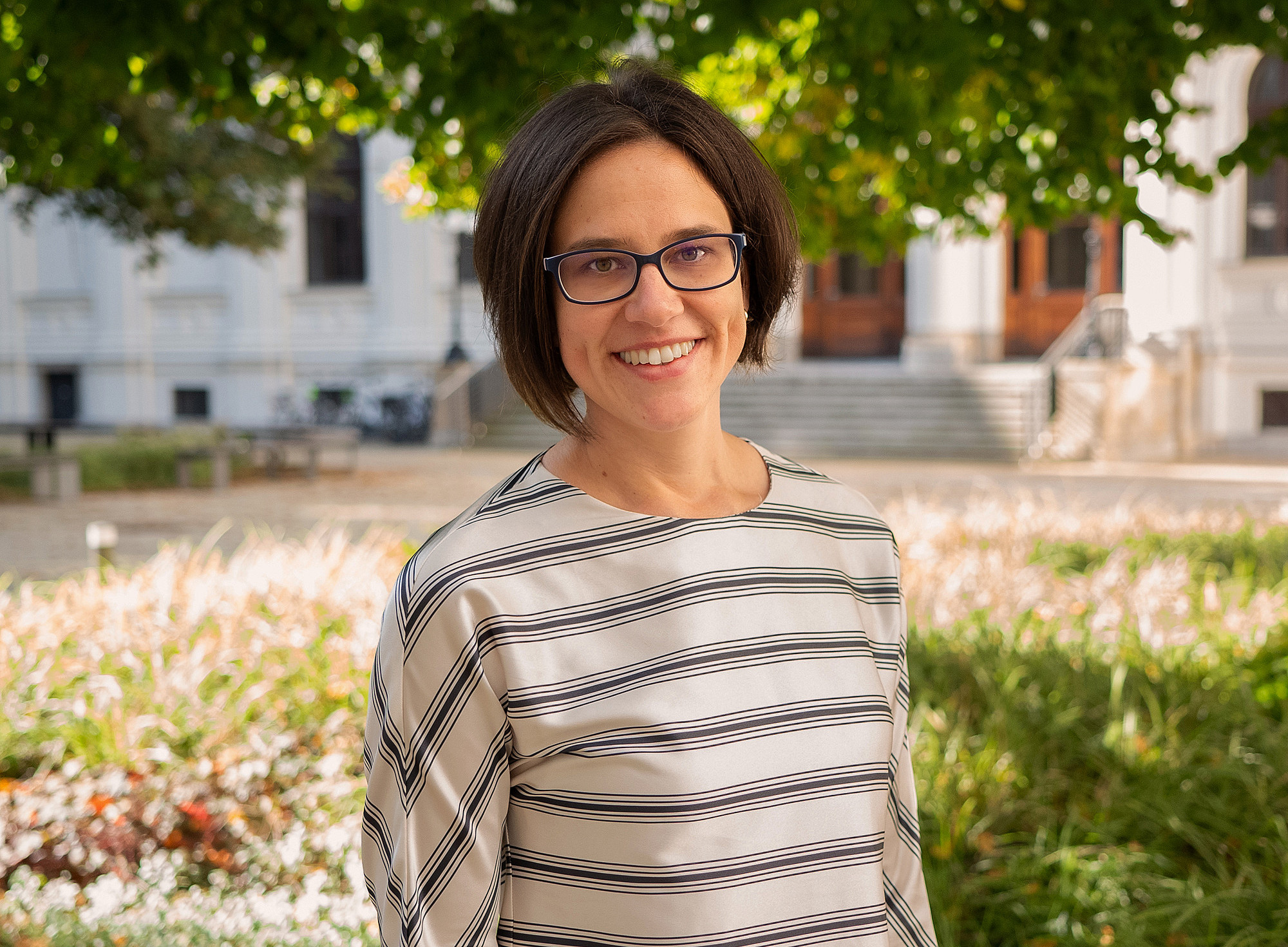 Portrait of Maria Bertel in the courtyard of the main building of the University of Graz 