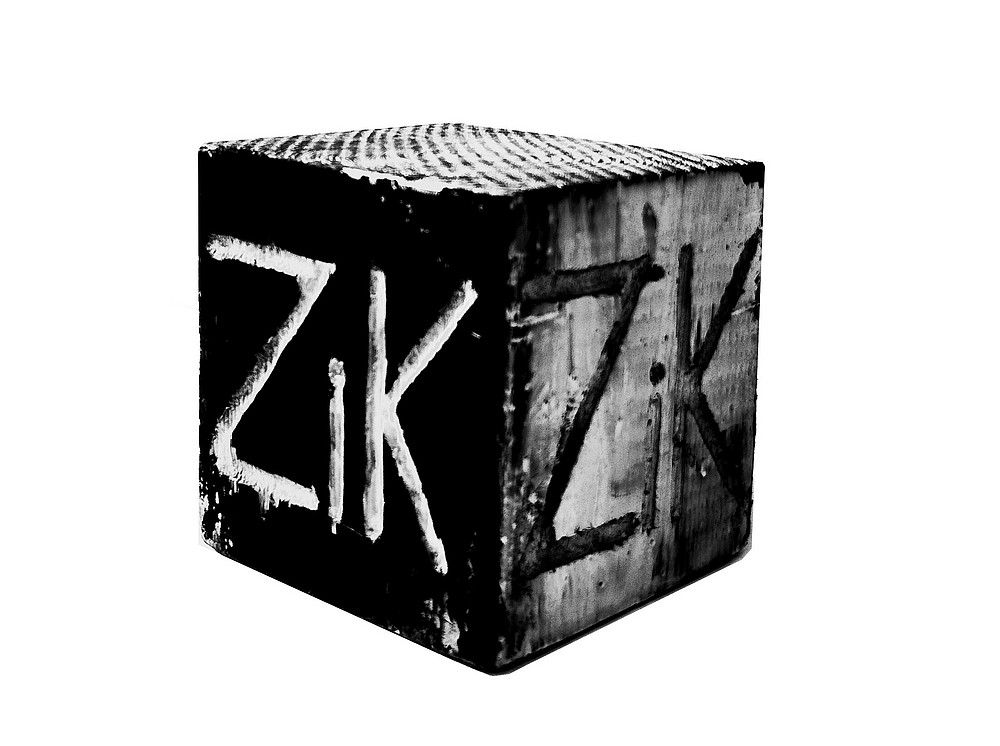 Wooden cube with engraving 'ZiK' 