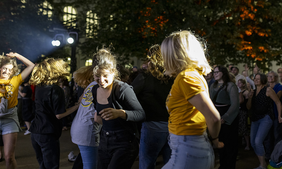 Dancing people in the courtyard