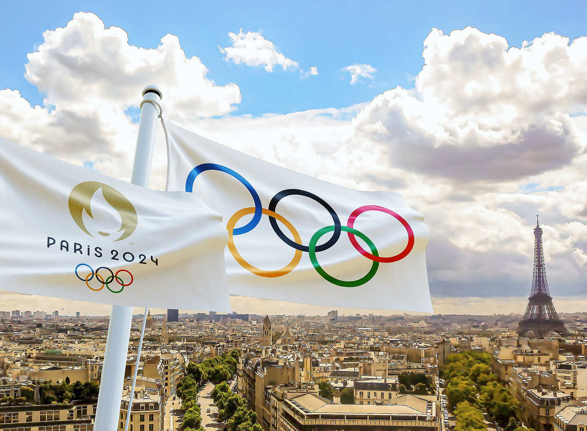 Olympia-Flagge vor dem Panorama von Paris 