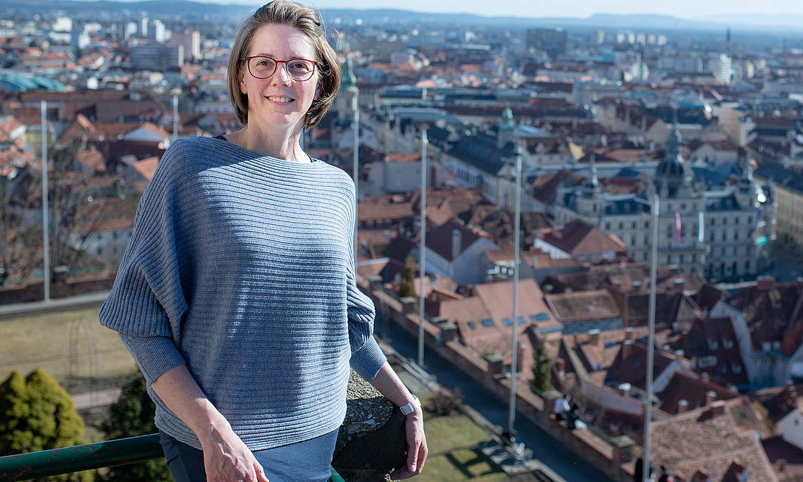 Birgit Bednar-Friedl on the Schlossberg in Graz, in the background below the city with the town hall