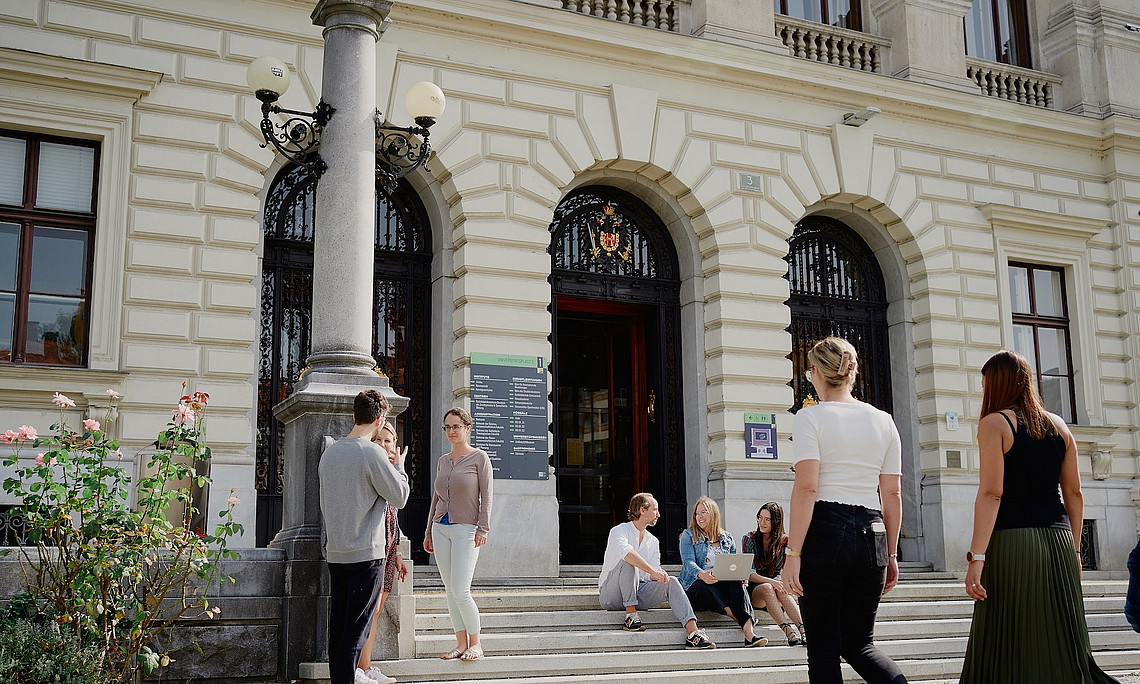 people in front of the main building