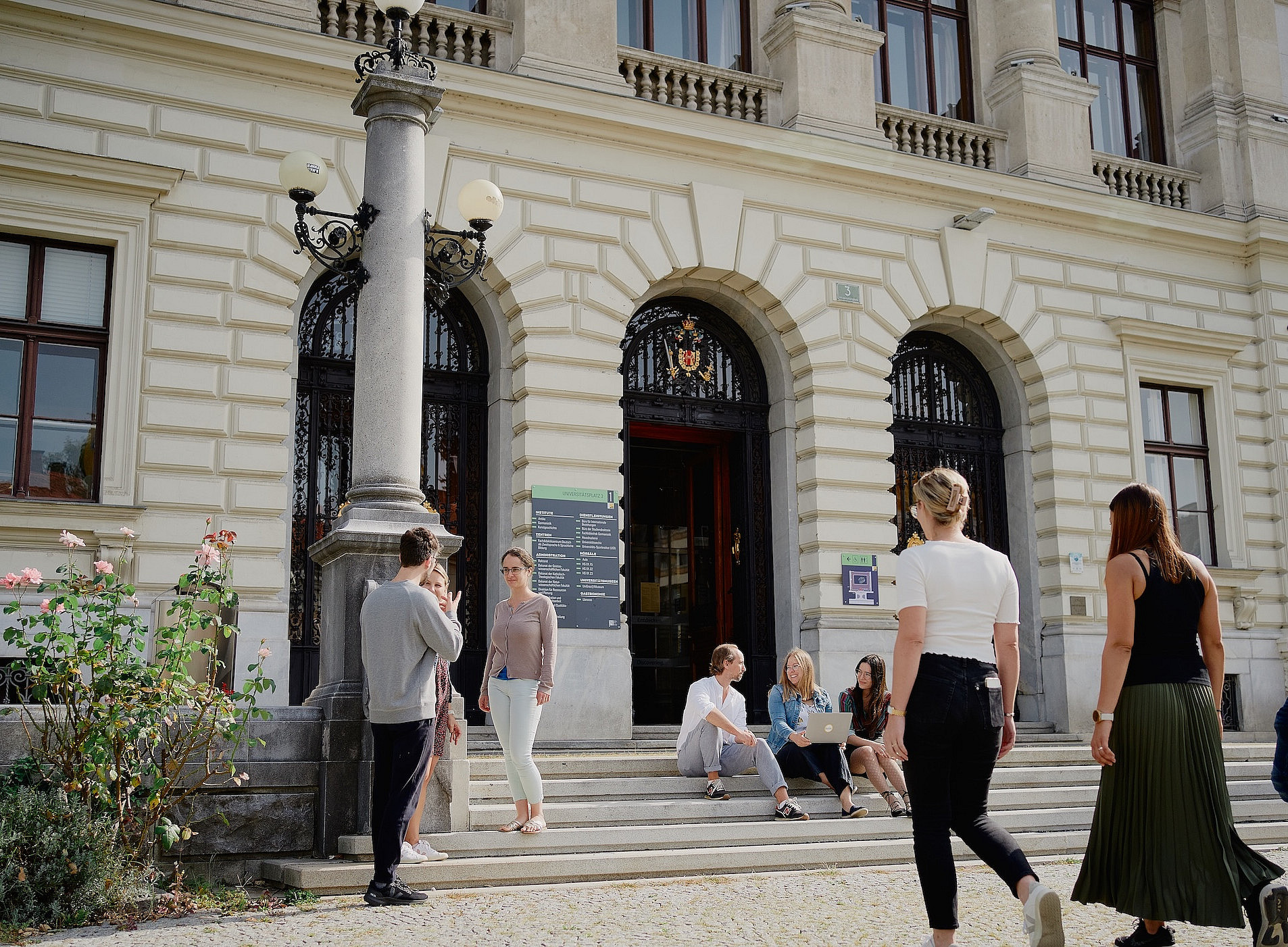people in front of the main building 