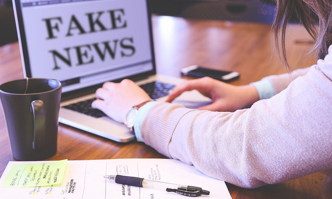 Fake news written on a laptop