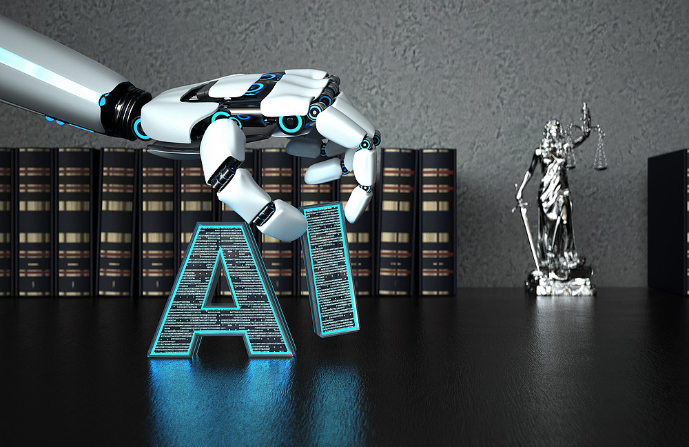 Buchstaben "AI" und eine Roboterhand ©Alexander Limbach