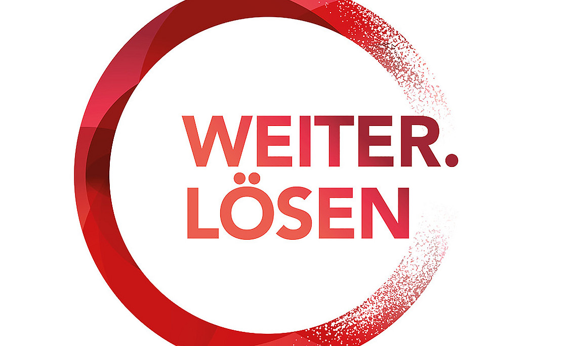 Logo aus rotem Kreis mti Text "Weiter. Lösen"
