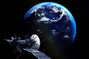 Satellite in space in front of the earth