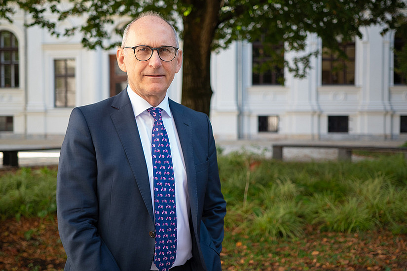 Gerhard Schnedl in the courtyard of the main building of the University of Graz in front of the lime tree