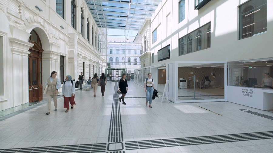 The foyer of the university library is frequented by students